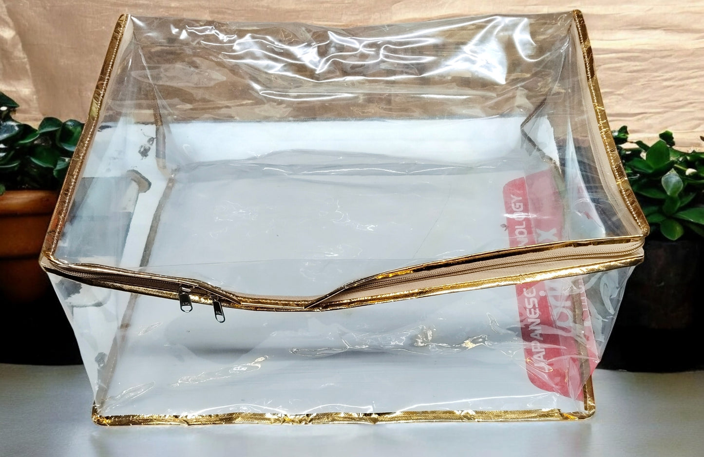 Transparent PVC chaniya cover with golden piping, size 15x18x9 inches