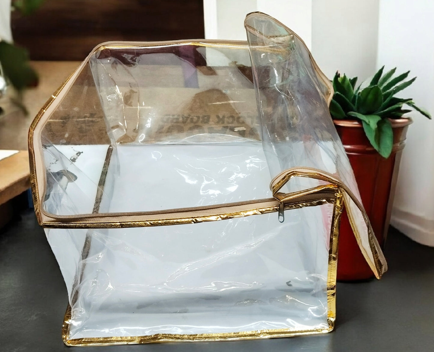 Designer bridal chaniya and gown cover in transparent PVC with golden border