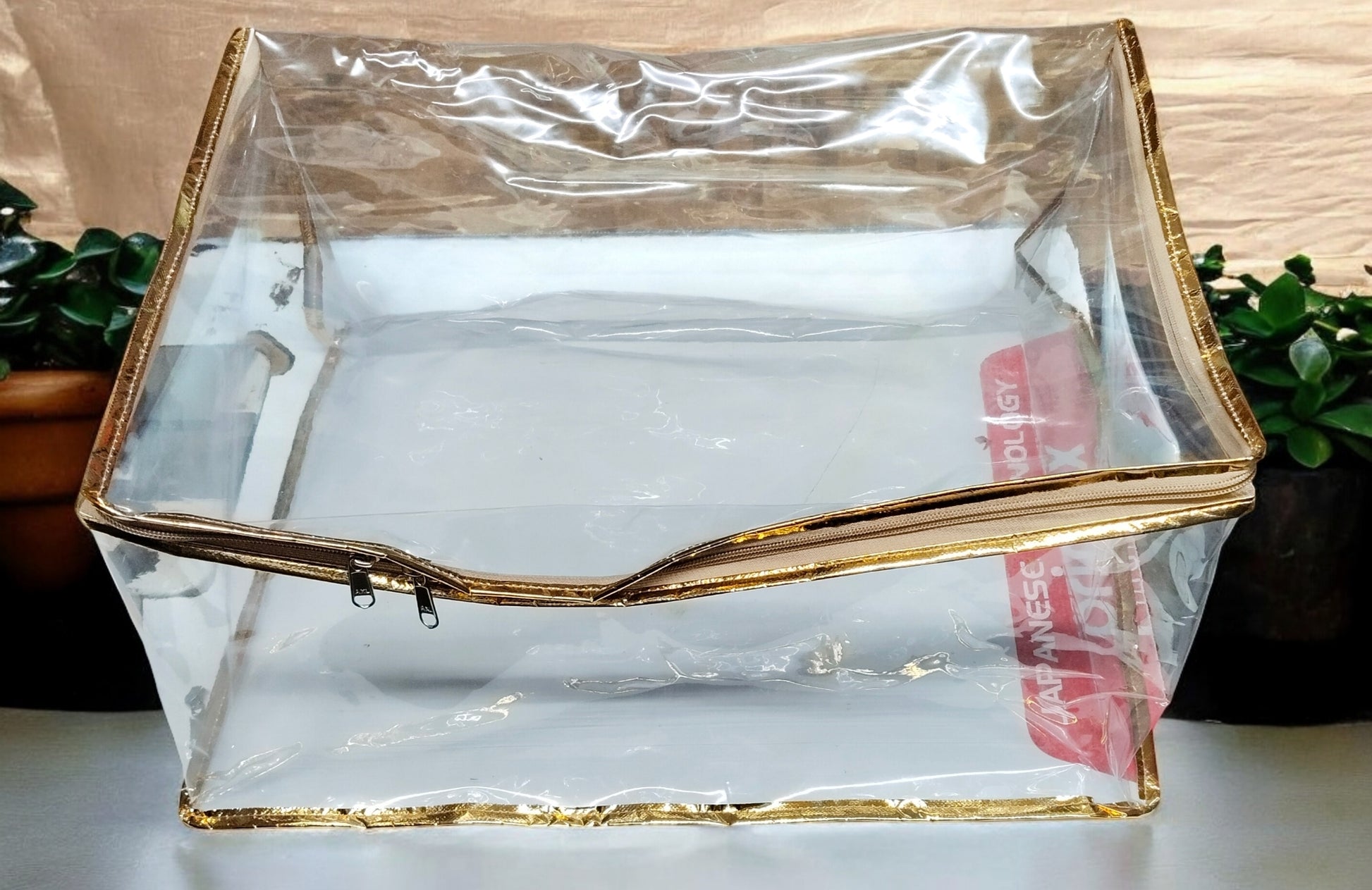 Transparent PVC chaniya cover with golden piping, size 15x18x9 inches